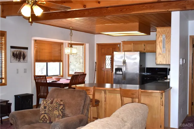 a lobby with furniture and large windows
