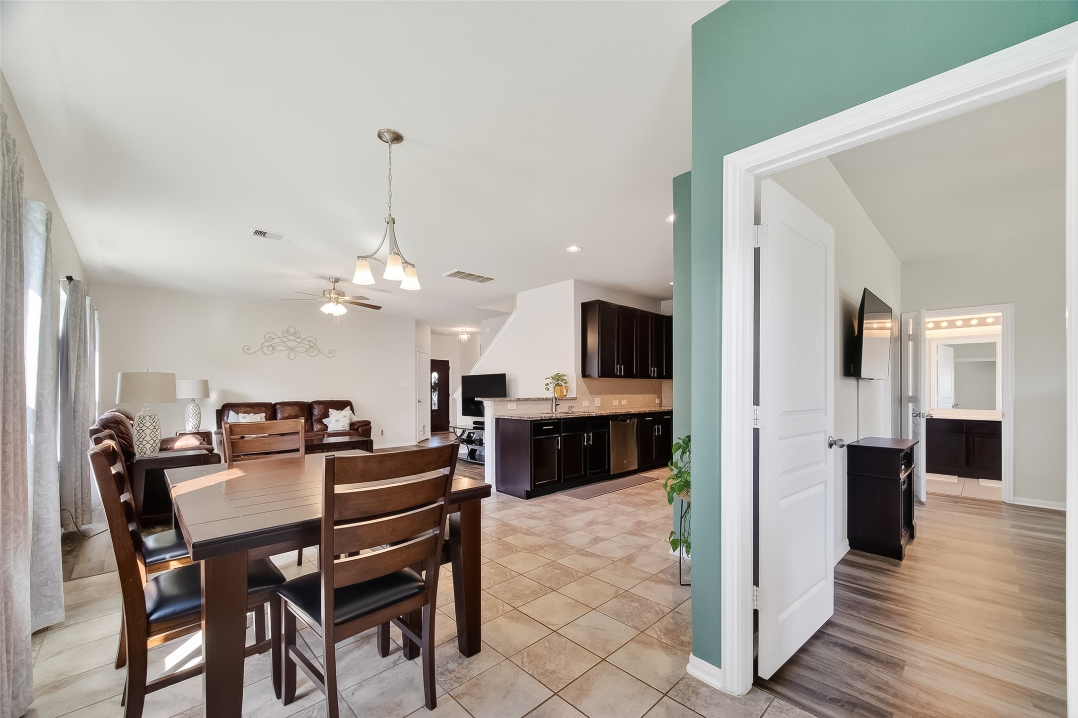 8630 Willet Street Baytown, TX 77521 - Photo 17 of 48 entrance to primary bedroom off dining space