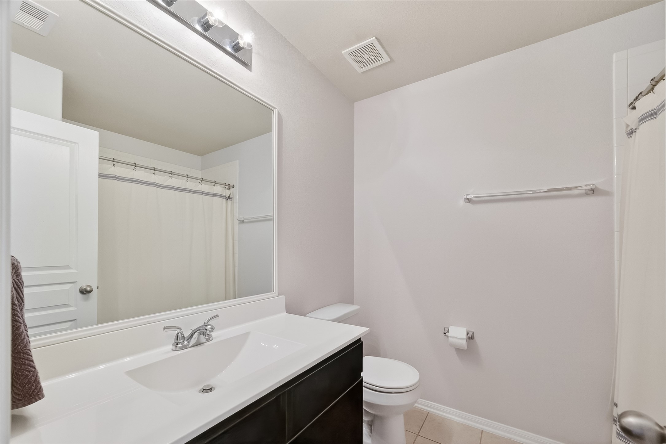 8630 Willet Street Baytown, TX 77521 - Photo 29 of 48 a bathroom with a sink a toilet and shower