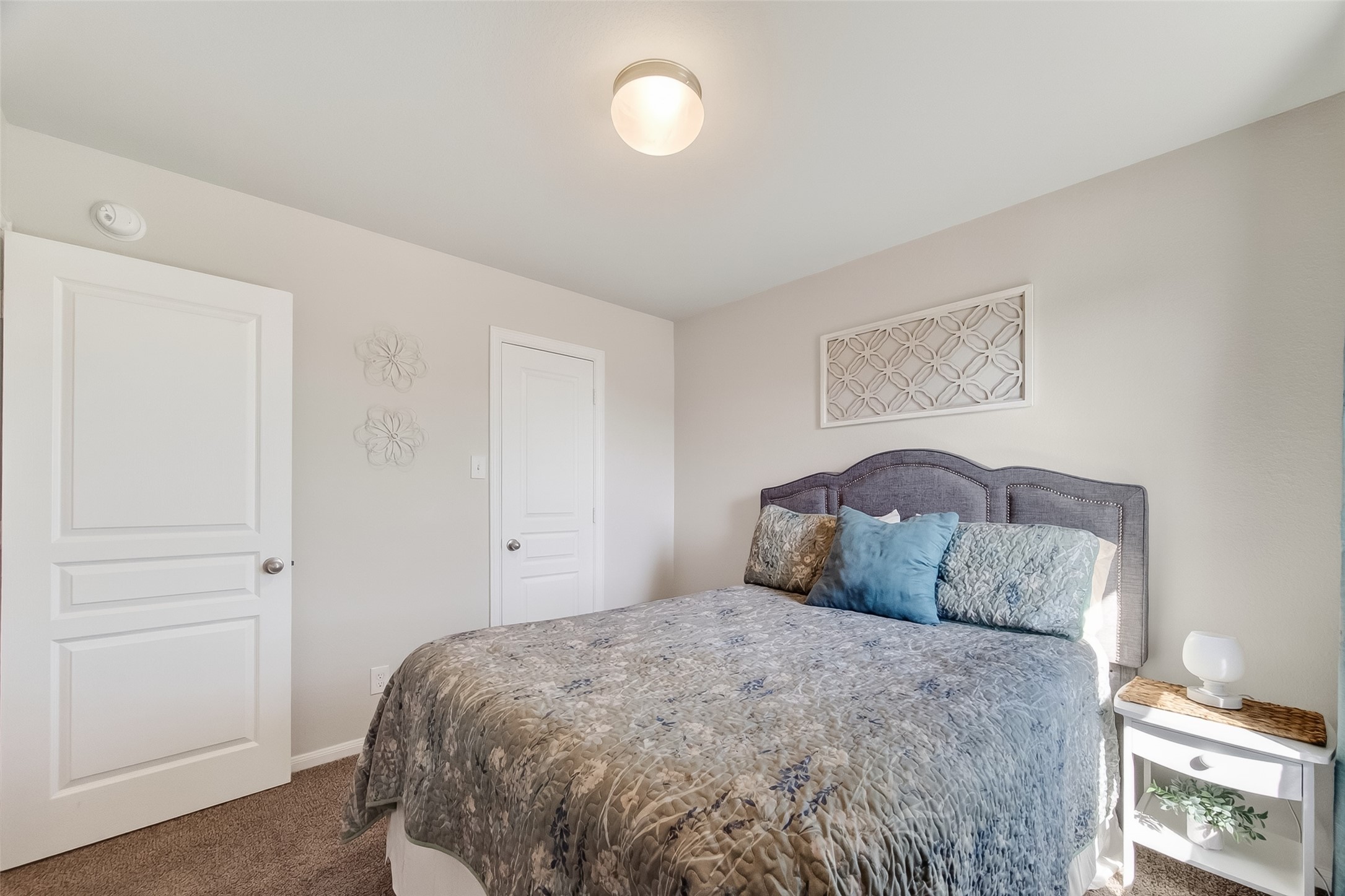 8630 Willet Street Baytown, TX 77521 - Photo 33 of 48 a bedroom with a bed and a window