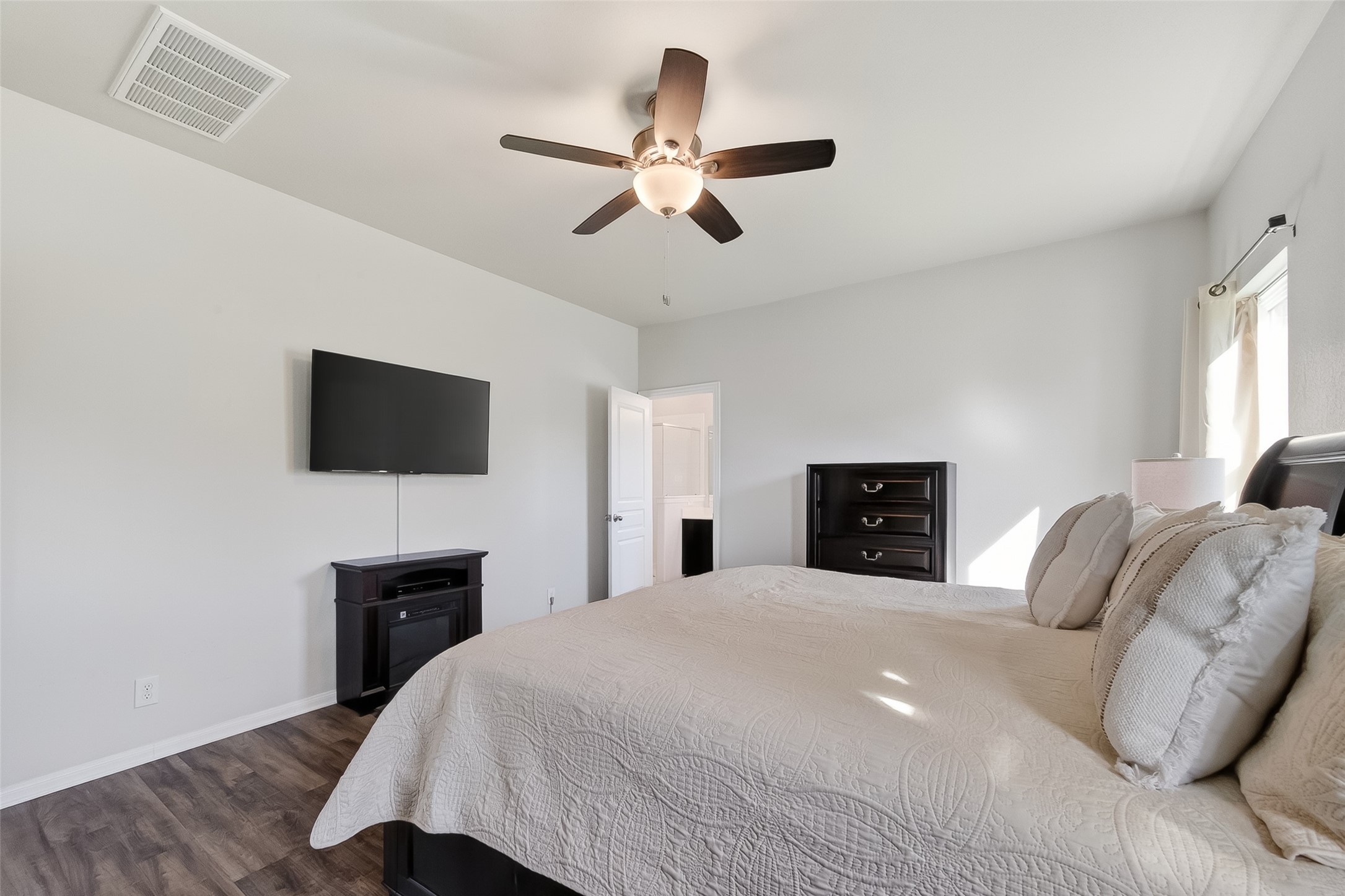 8630 Willet Street Baytown, TX 77521 - Photo 35 of 48 a bedroom with a bed and a flat screen tv