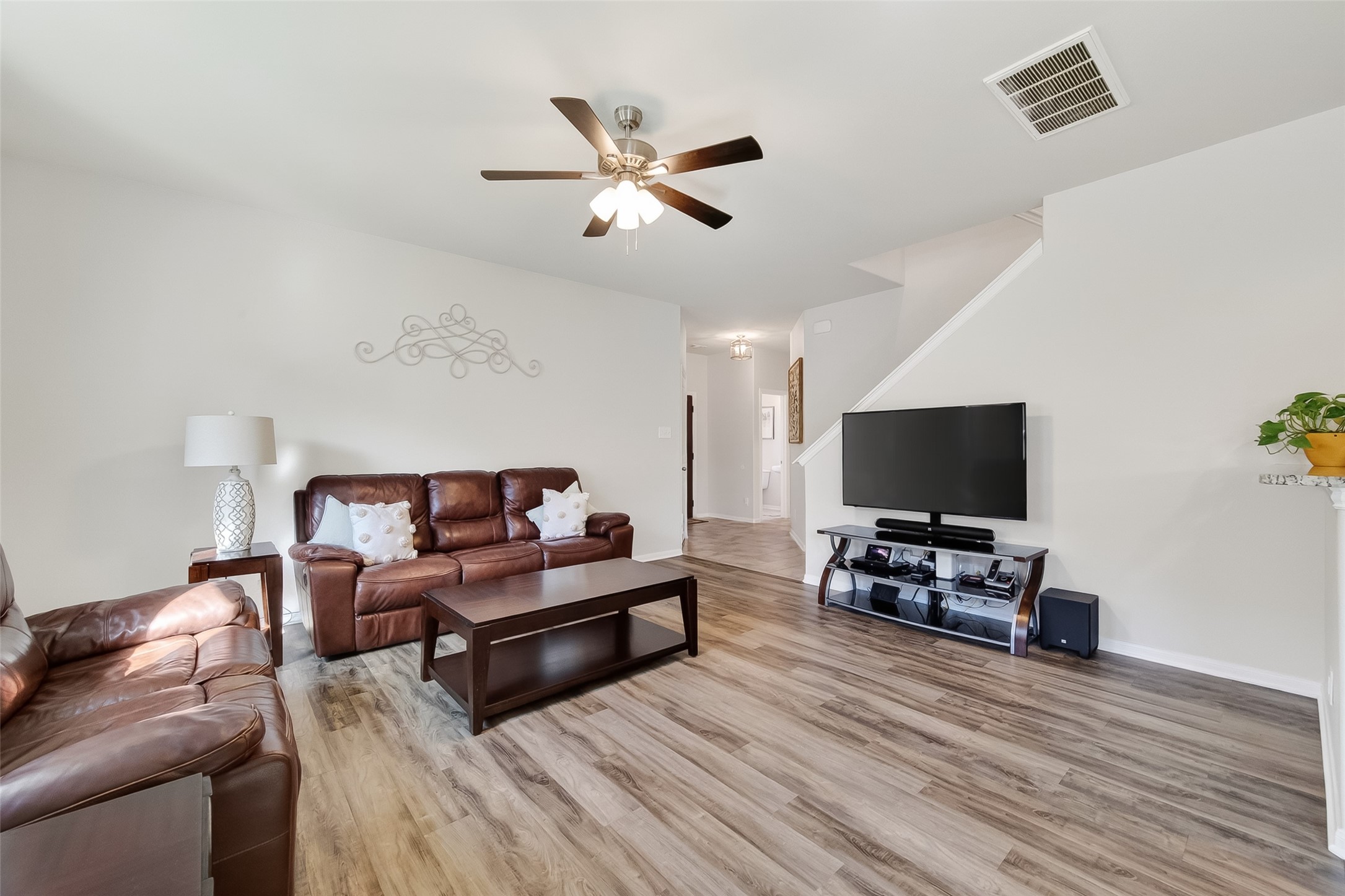 8630 Willet Street Baytown, TX 77521 - Photo 6 of 48 a living room with furniture and a flat screen tv