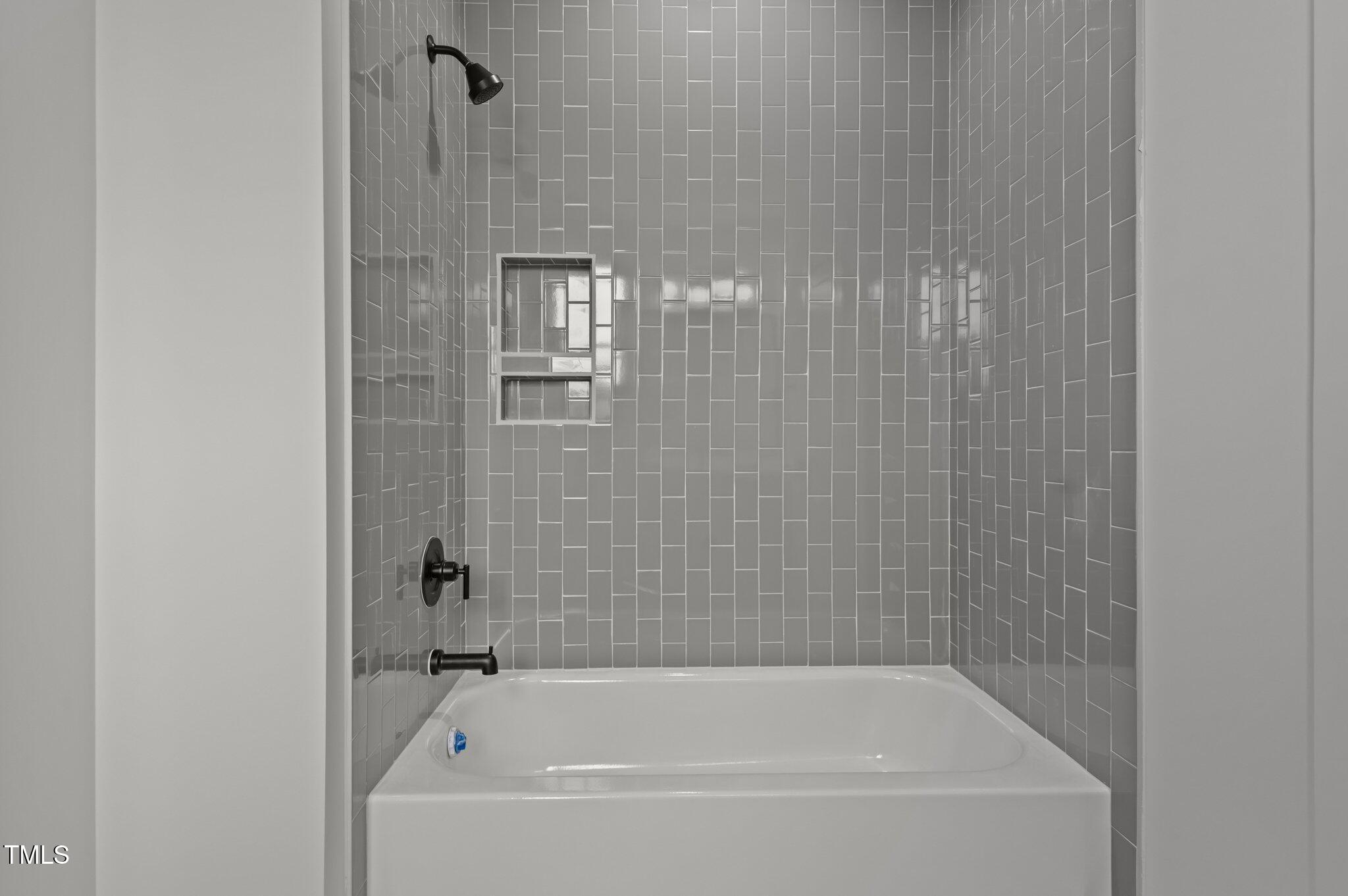 200 Broadleaf Lane Louisburg, NC 27549 - Photo 35 of 57 a bathroom with a bathtub