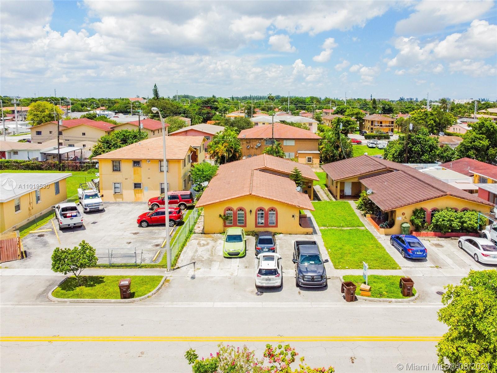 an aerial view of residential houses and outdoor space