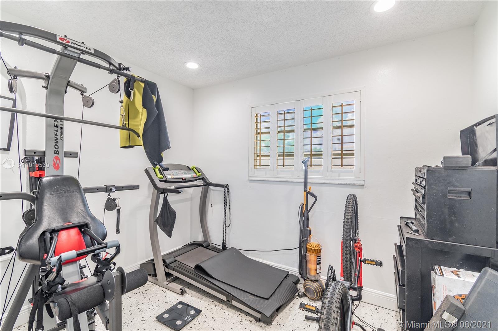 Hialeah Acres Hialeah, FL 33010 - Photo 12 of 45 a view of a room with gym equipment