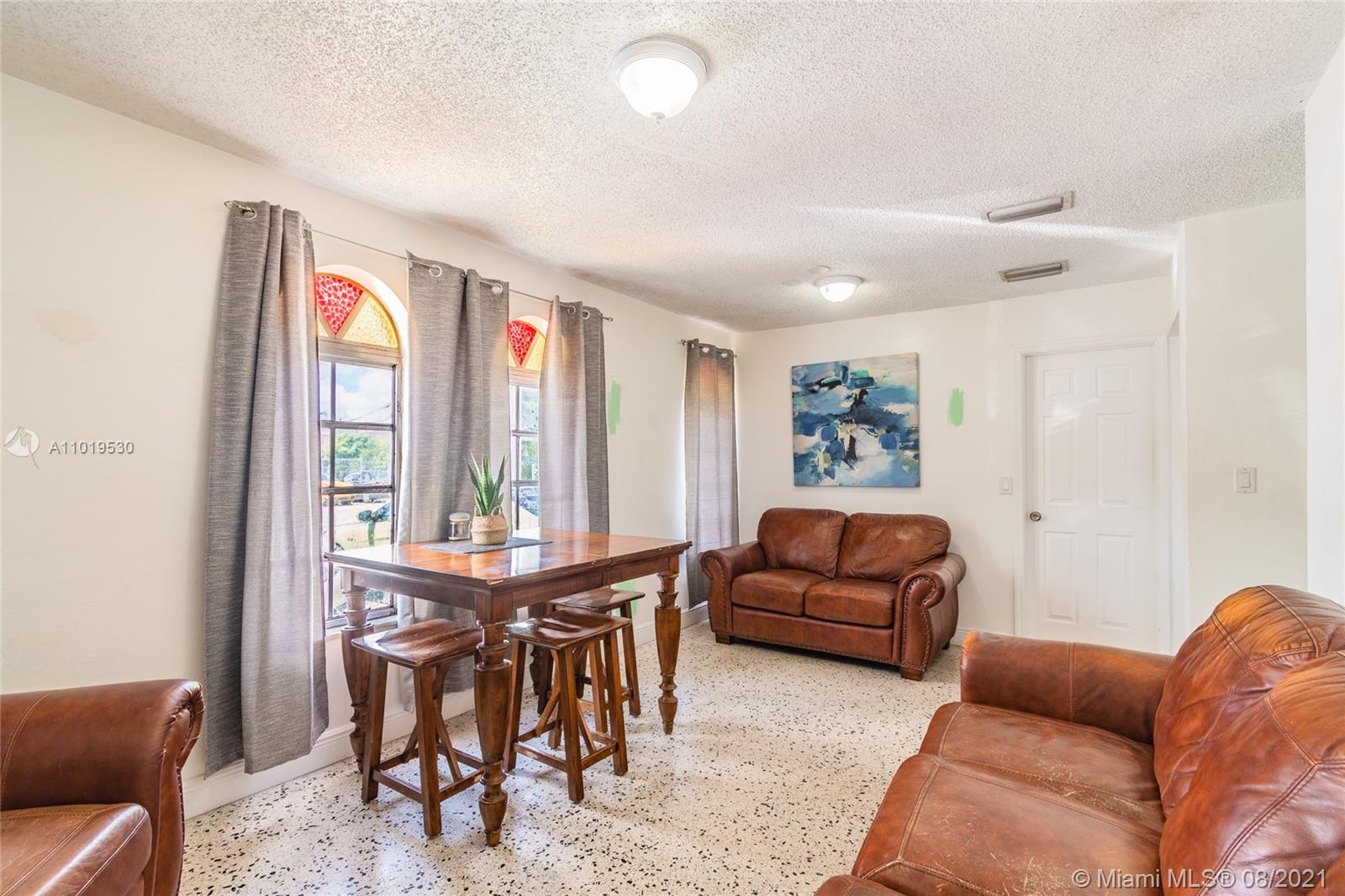 Hialeah Acres Hialeah, FL 33010 - Photo 18 of 45 a living room with furniture and a large window