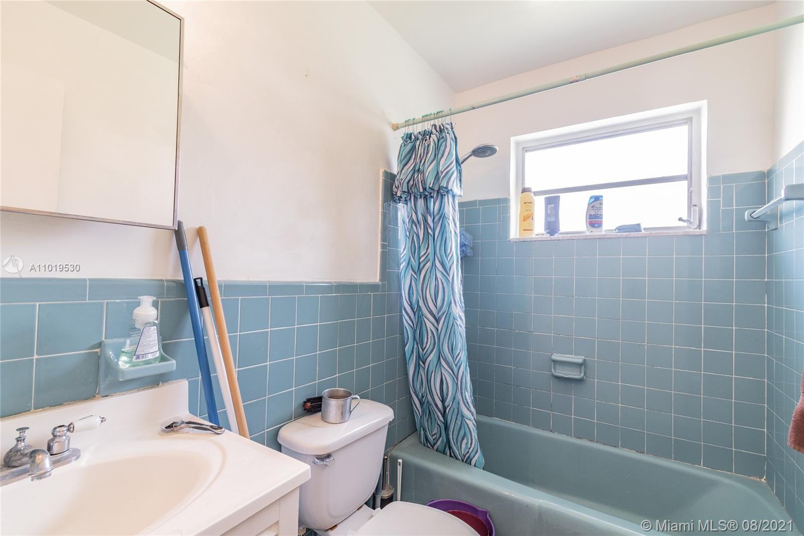 Hialeah Acres Hialeah, FL 33010 - Photo 28 of 45 a bathroom with a sink a toilet and shower