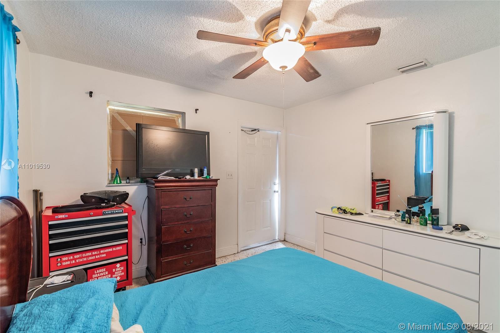 Hialeah Acres Hialeah, FL 33010 - Photo 29 of 45 a living room with furniture and a flat screen tv