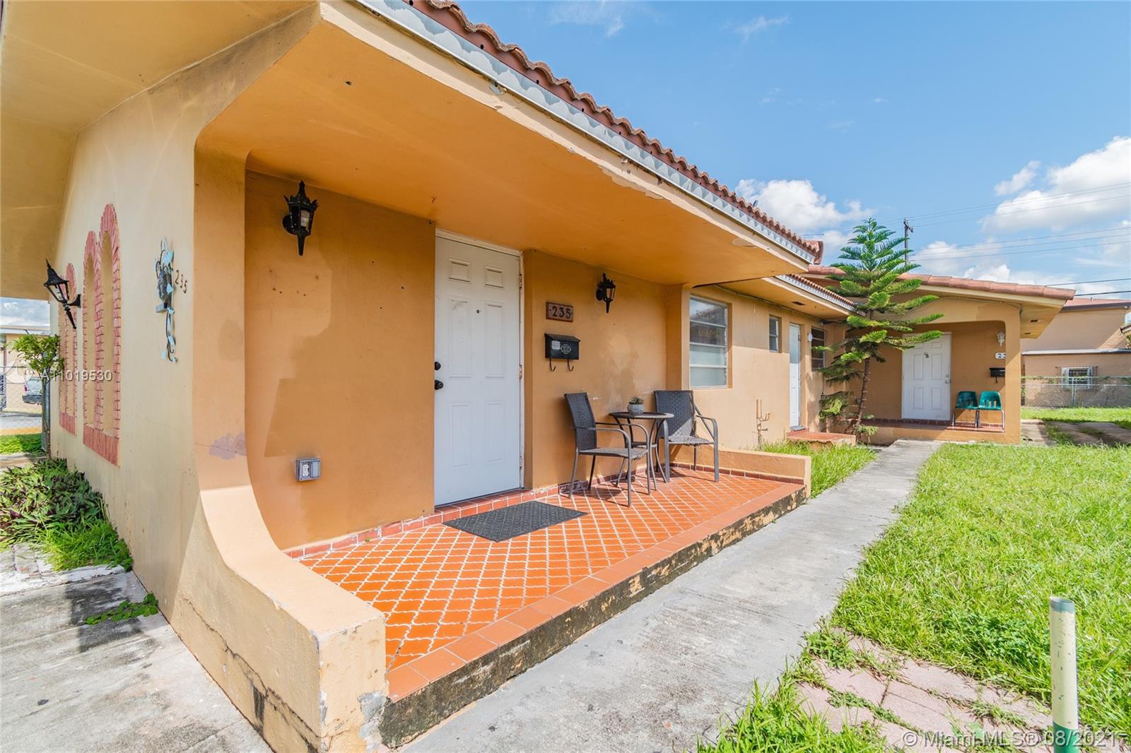 Hialeah Acres Hialeah, FL 33010 - Photo 4 of 45 a view of a patio with couches table and chairs and potted plants