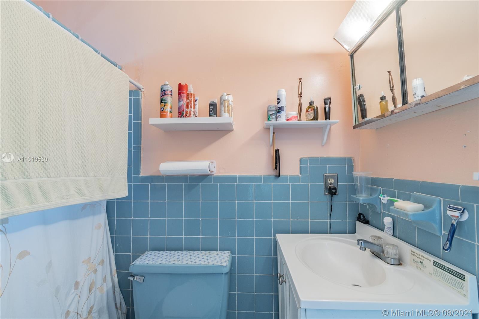 Hialeah Acres Hialeah, FL 33010 - Photo 42 of 45 a bathroom with a sink a toilet and a mirror