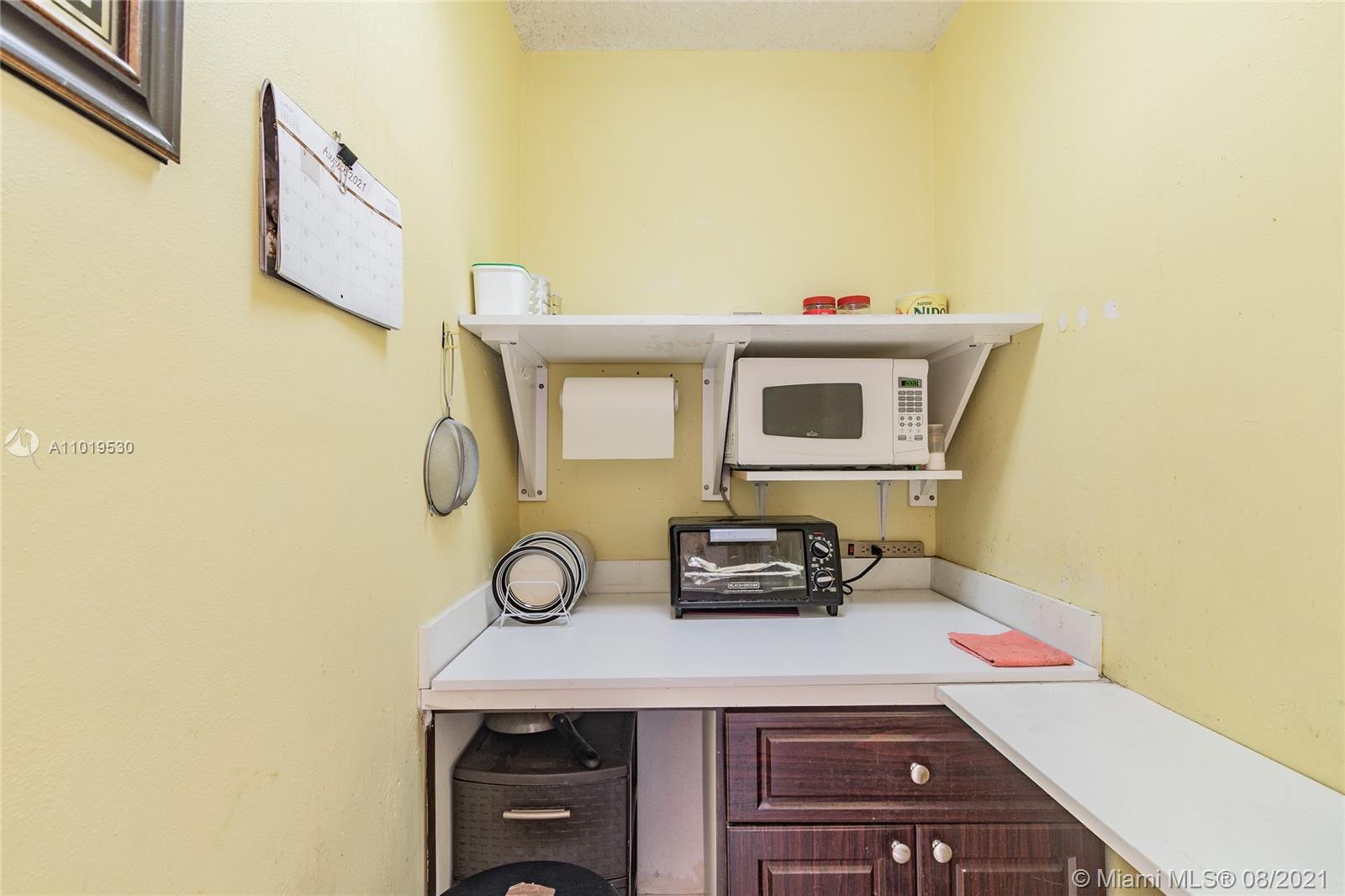 Hialeah Acres Hialeah, FL 33010 - Photo 43 of 45 a view of kitchen appliances with wooden cabinets
