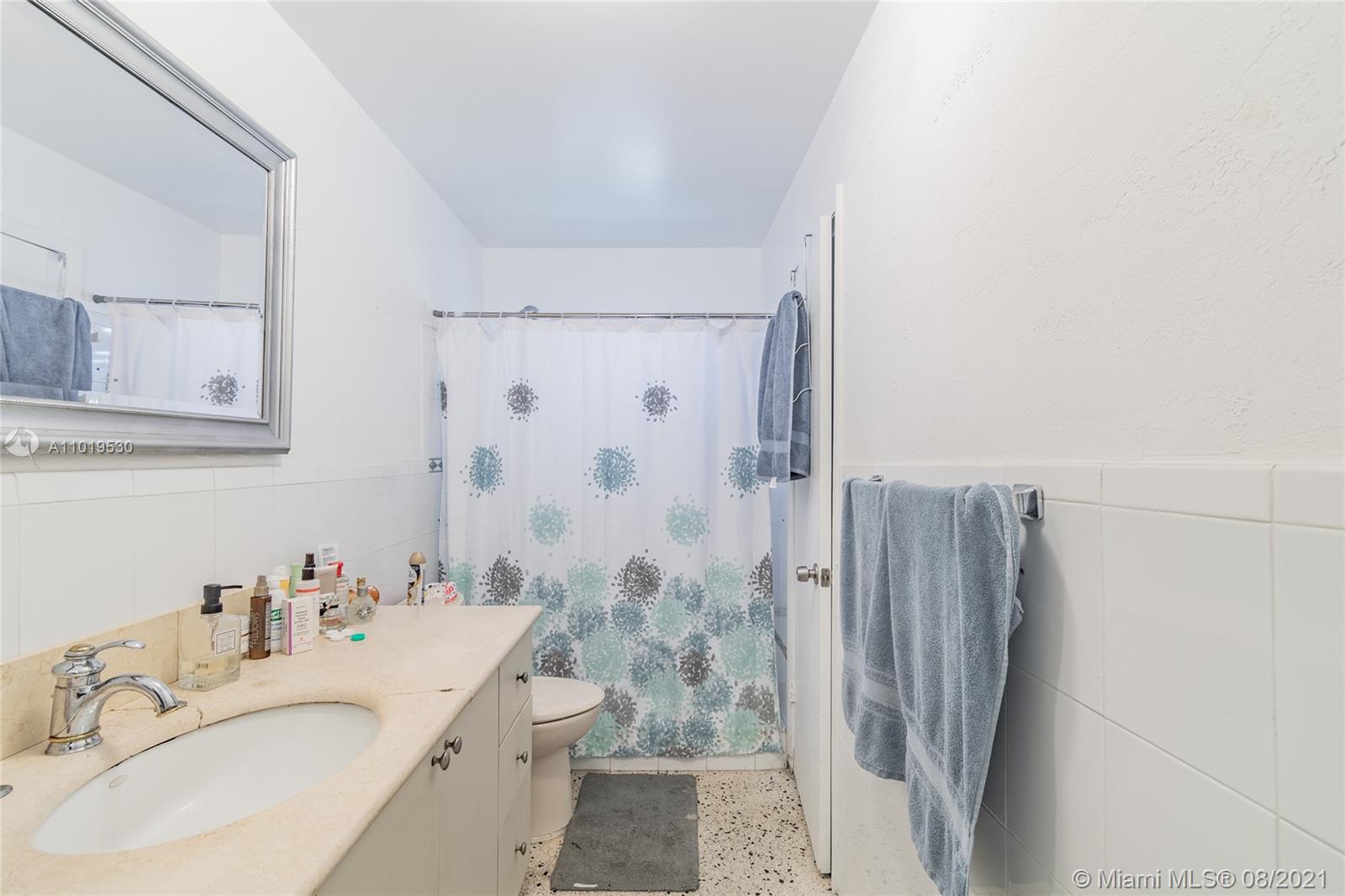 Hialeah Acres Hialeah, FL 33010 - Photo 9 of 45 a bathroom with a double vanity sink a shower and a mirror