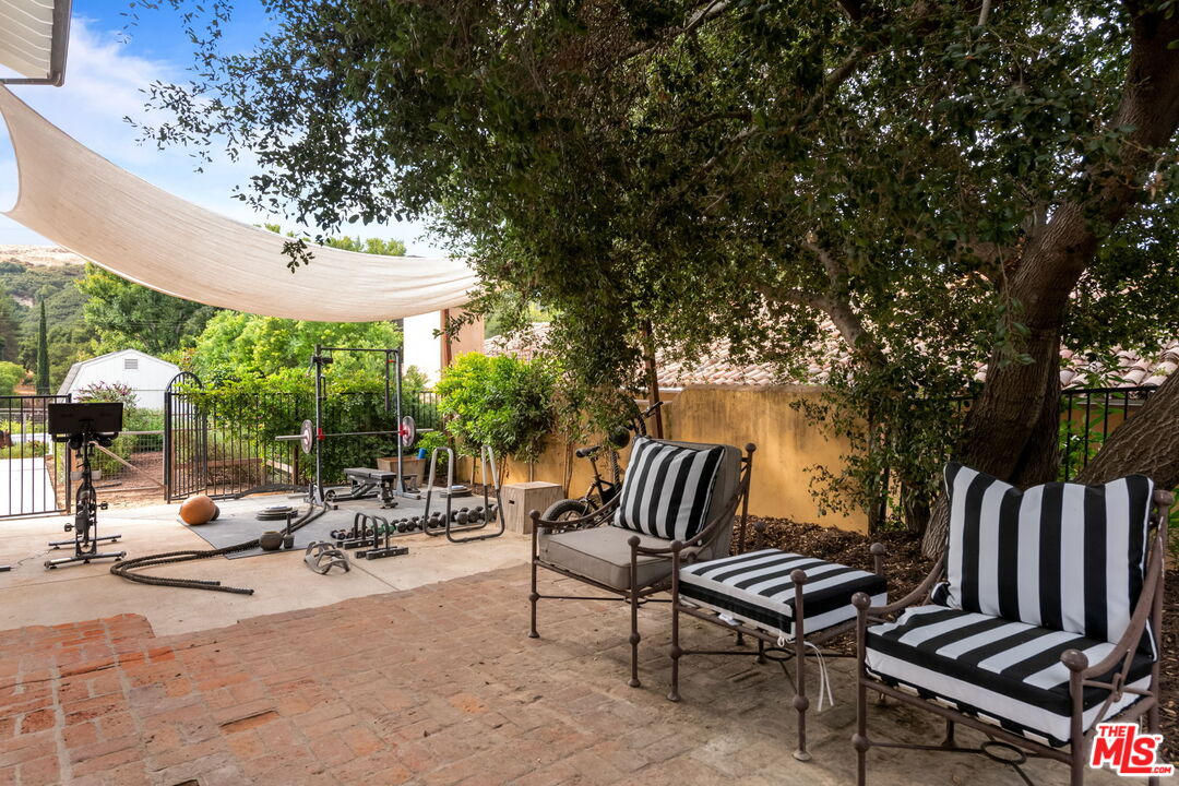 2437 Stokes Canyon Road Calabasas, CA 91302 - Photo 23 of 60 a view of swimming pool with chairs