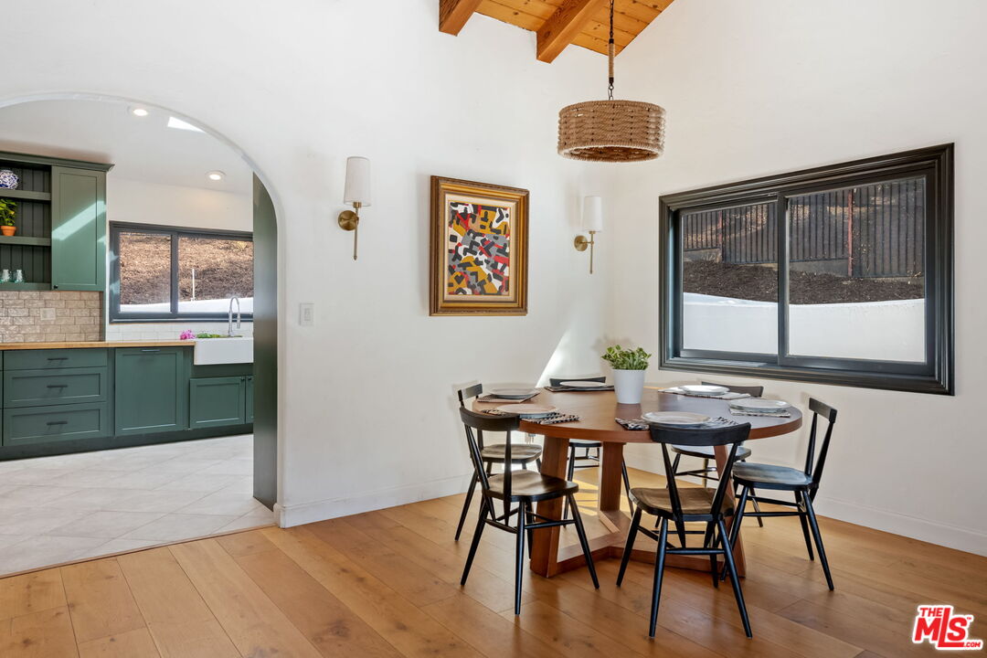 2437 Stokes Canyon Road Calabasas, CA 91302 - Photo 8 of 60 a view of a dining room with furniture and window