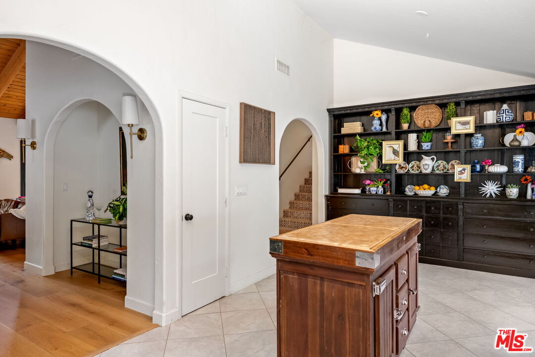 2437 Stokes Canyon Road Calabasas, CA 91302 - Photo 10 of 60 a kitchen with stainless steel appliances a refrigerator and a counter space