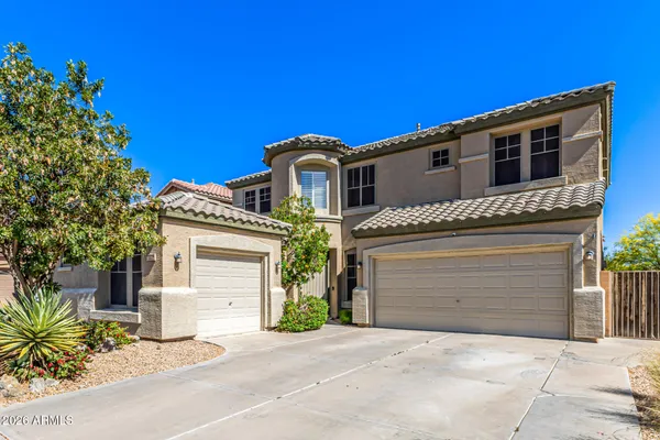 a front view of a house with a garage
