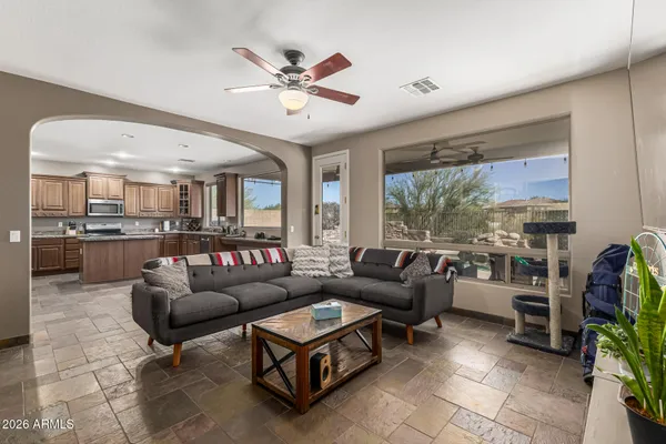a living room with furniture and a large window