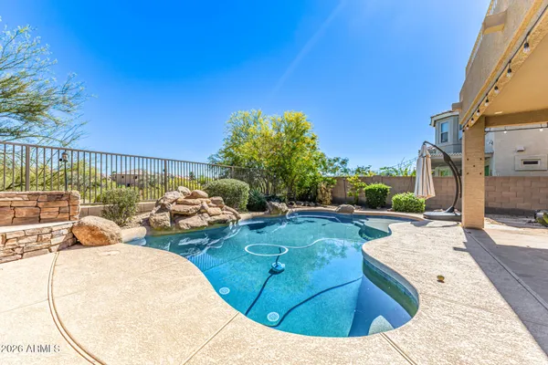 a view of a swimming pool with a patio