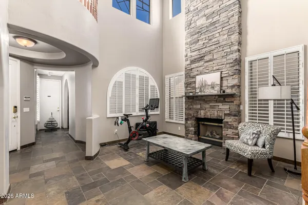 a living room with furniture a fireplace and a table