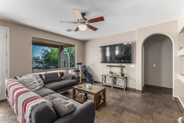 a living room with furniture and a flat screen tv