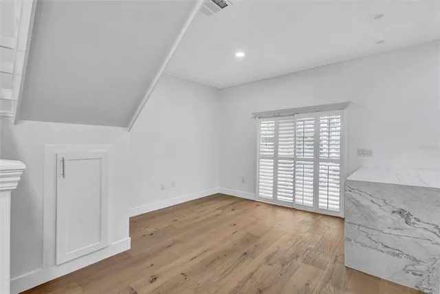 a view of entryway with wooden floor