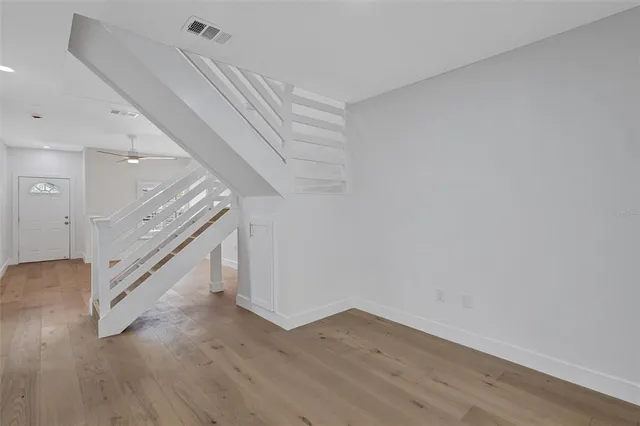 a view of entryway with wooden floor