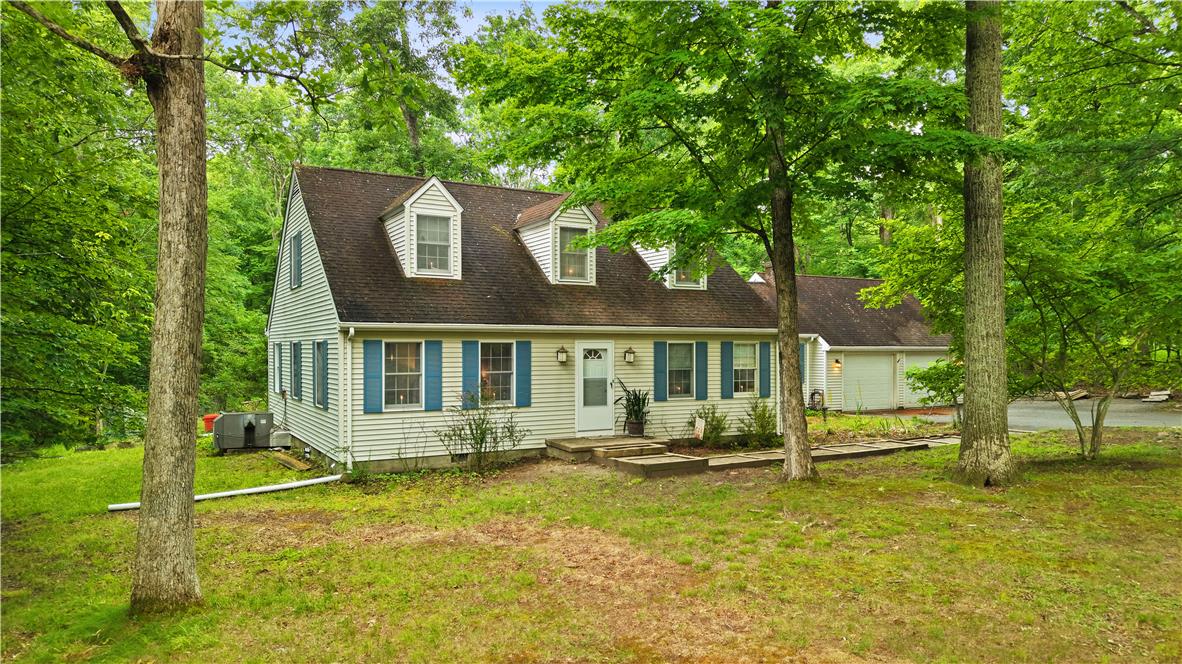 209 Remington Road East Stroudsburg, PA 18301 - Photo 1 of 41 A charming dwelling nestled among a canopy of mature trees offers a private, serene escape.