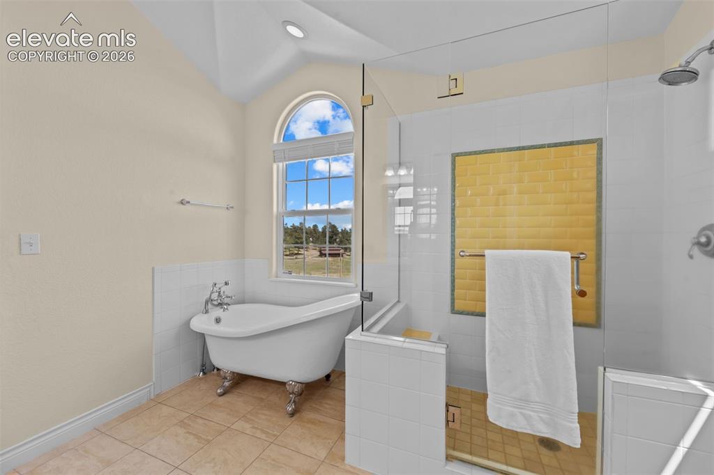 16540 Mesquite Road Peyton, CO 80831 - Photo 29 of 50 a bathroom with a sink toilet and tub