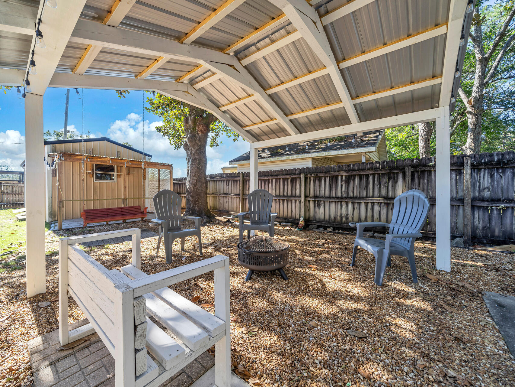 607 Alabama Street Crestview, FL 32536 - Photo 20 of 31 a view of a chairs and table in a patio