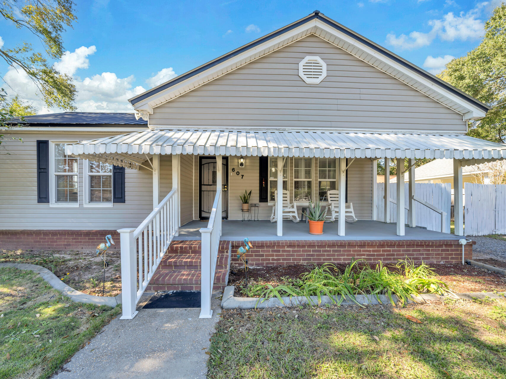 607 Alabama Street Crestview, FL 32536 - Photo 2 of 31 a front view of a house with a yard