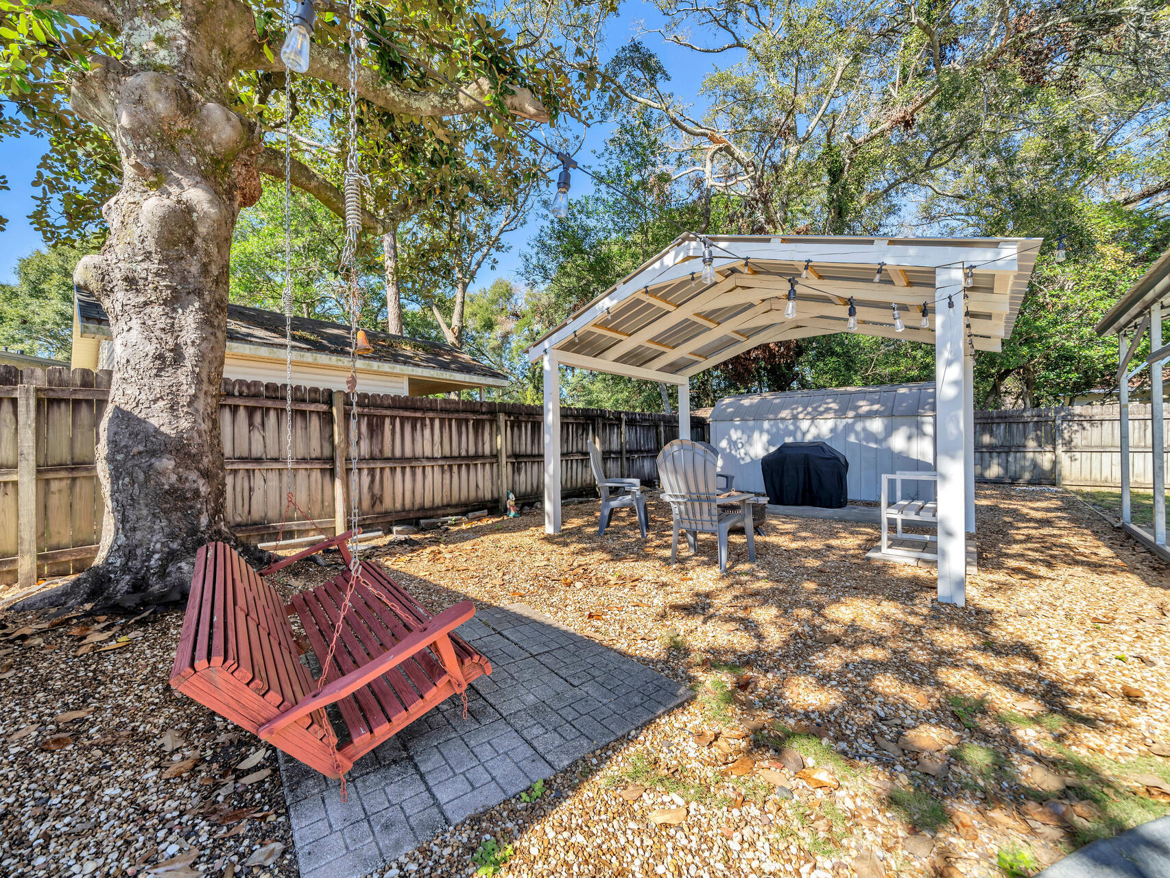 607 Alabama Street Crestview, FL 32536 - Photo 21 of 31 a view of a backyard with a patio