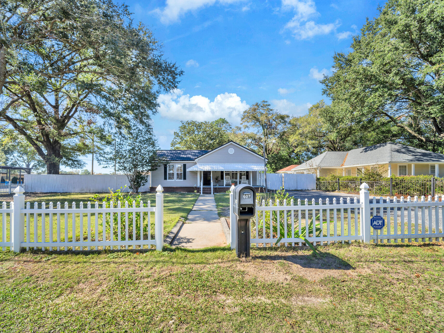 607 Alabama Street Crestview, FL 32536 - Photo 29 of 31 a view of a house with a yard and deck