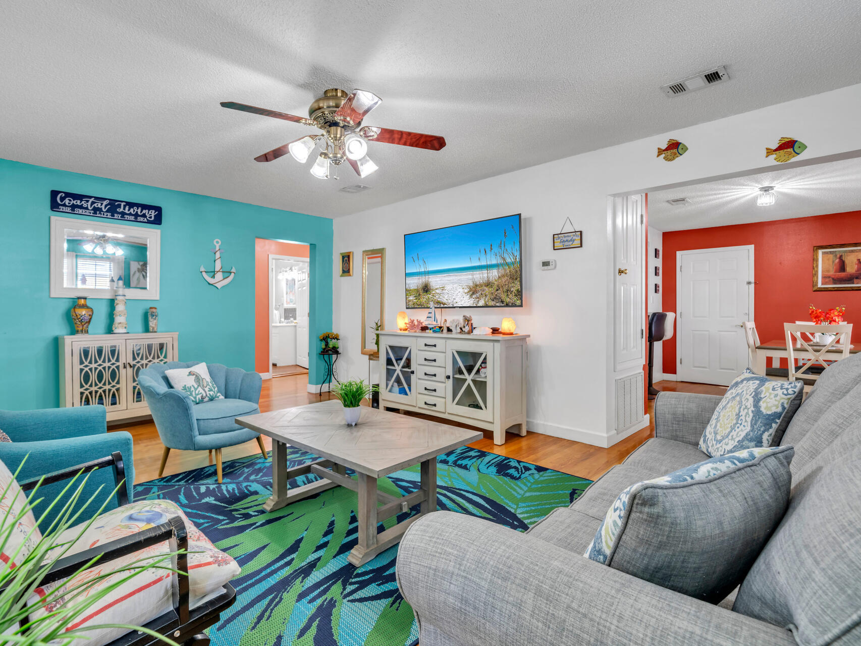607 Alabama Street Crestview, FL 32536 - Photo 7 of 31 a living room with furniture and a chandelier