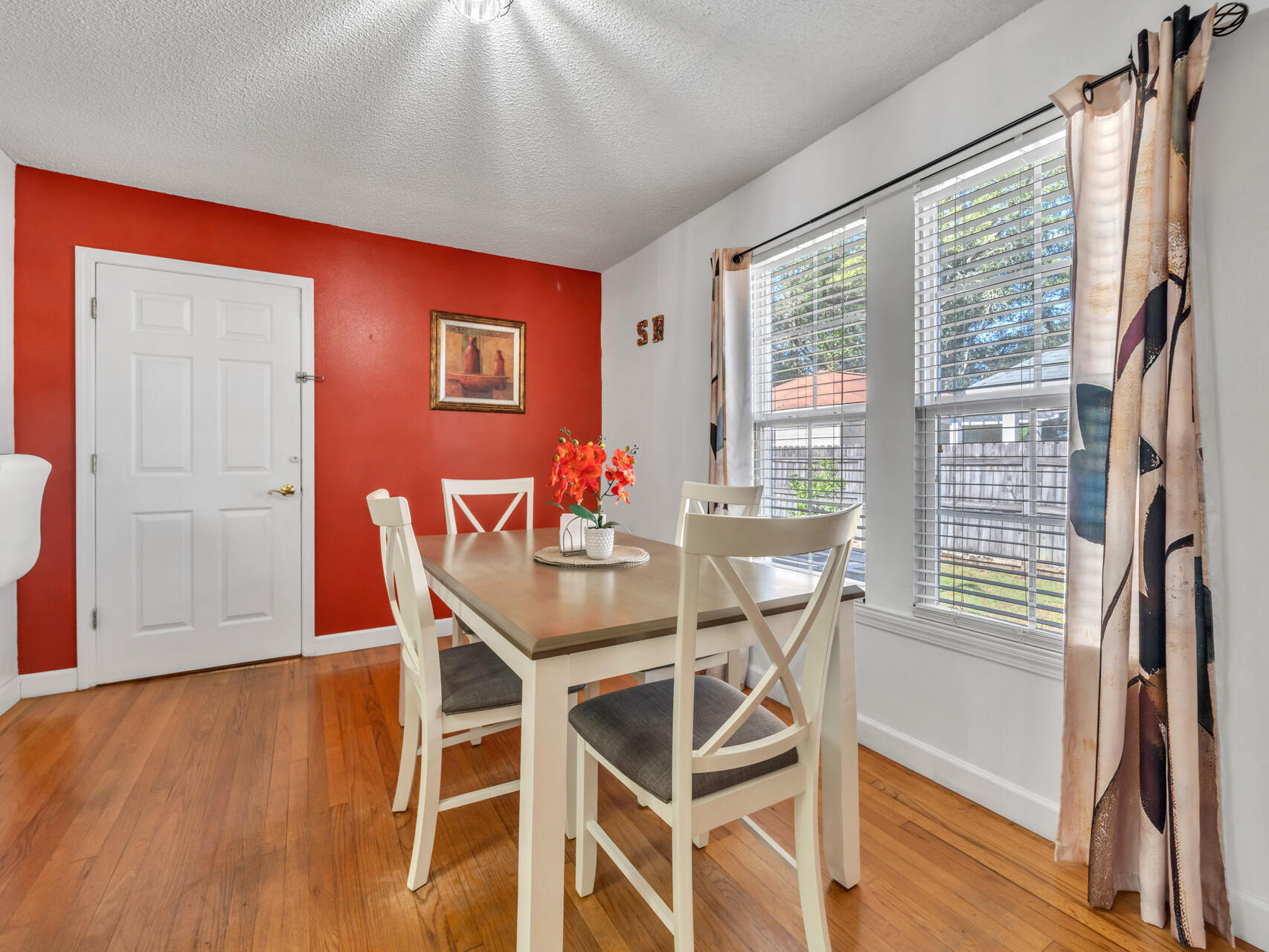 607 Alabama Street Crestview, FL 32536 - Photo 8 of 31 a view of a dining room with furniture window and wooden floor