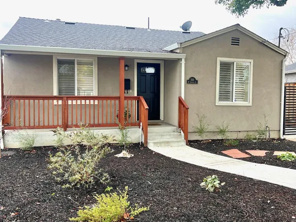 a front view of a house with garden