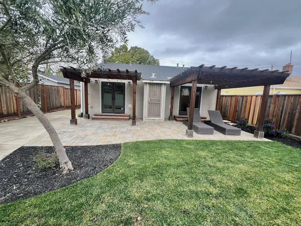 a view of a backyard with a patio