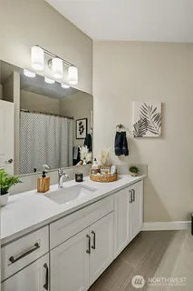 a view of a patio with table and chairs and wooden floor