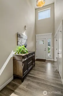 a living room with furniture a rug and a window