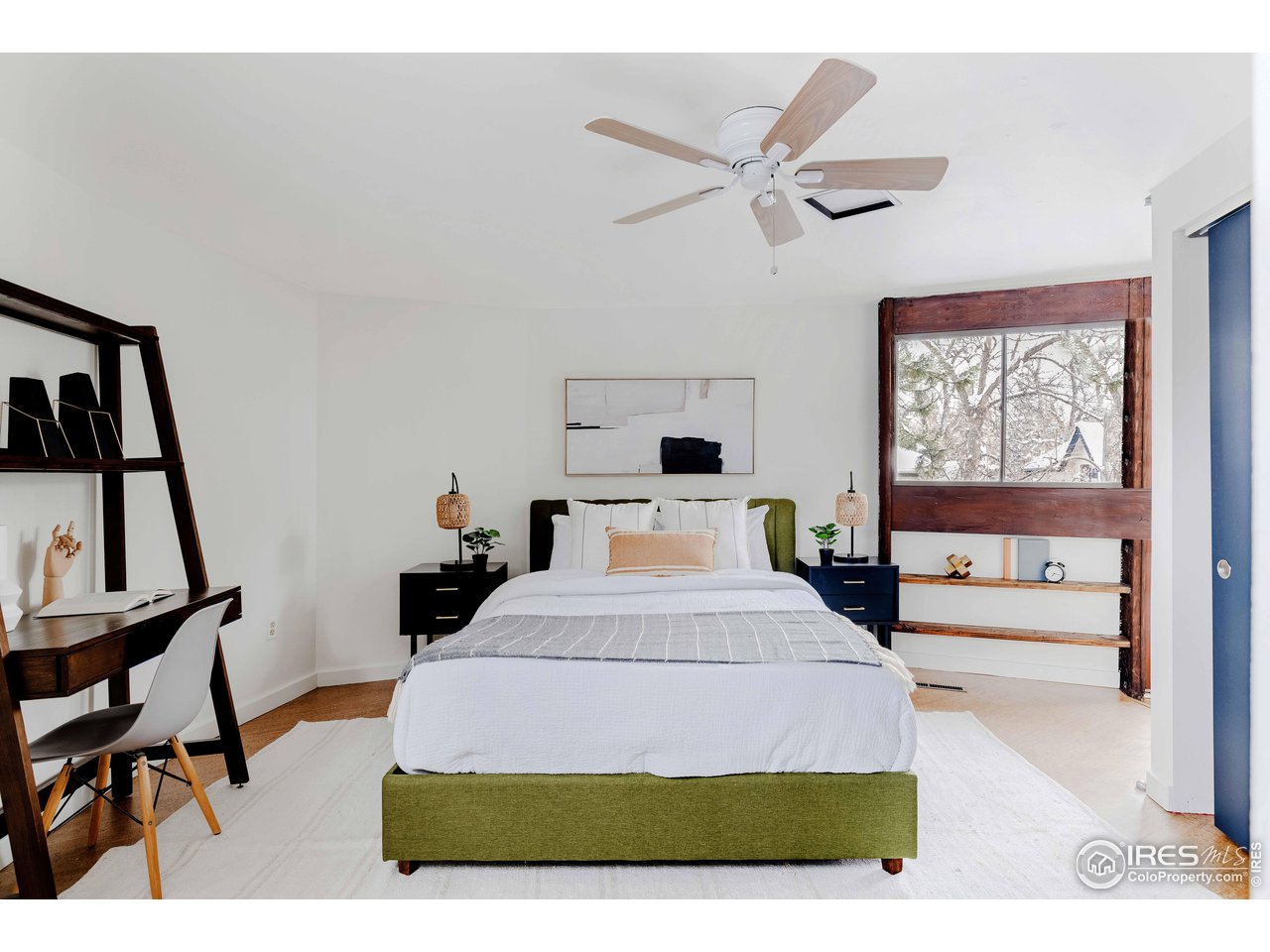 550 College Avenue Boulder, CO 80302 - Photo 18 of 36 a living room with a bed furniture and a window
