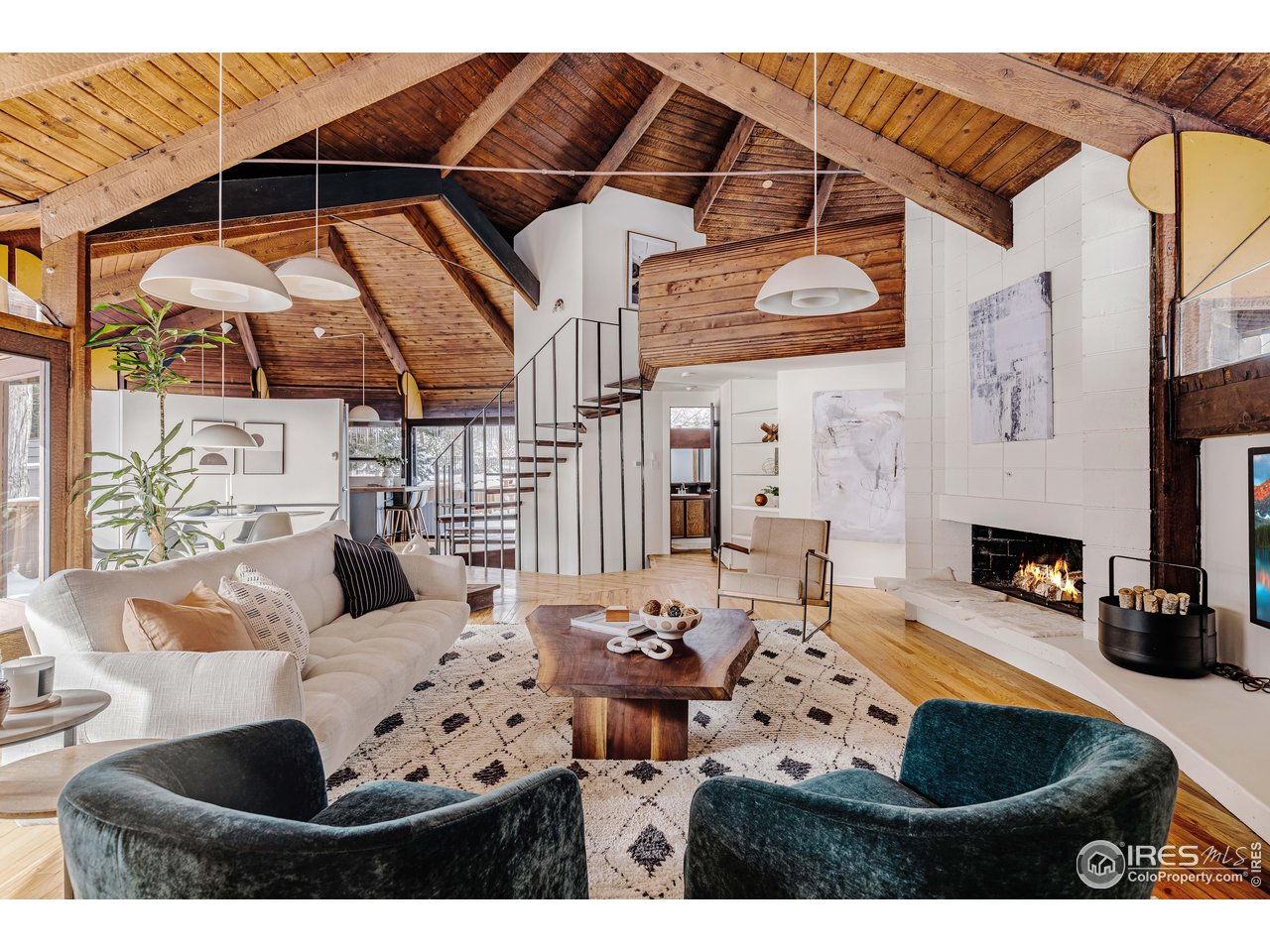 550 College Avenue Boulder, CO 80302 - Photo 2 of 36 a living room with furniture a fireplace and decor