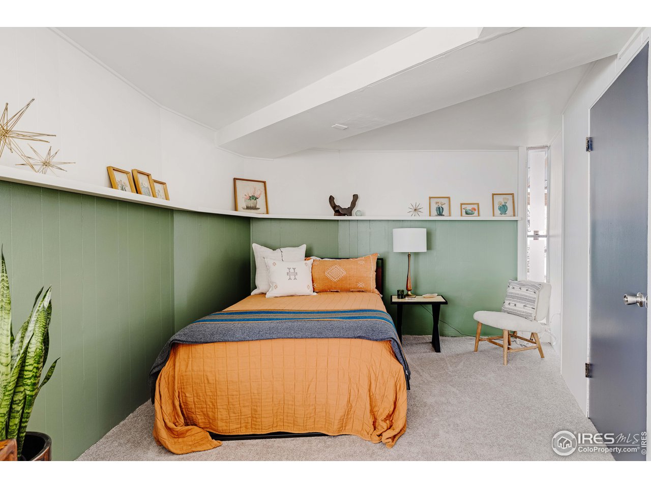 550 College Avenue Boulder, CO 80302 - Photo 22 of 36 a bedroom with a bed and wooden floor