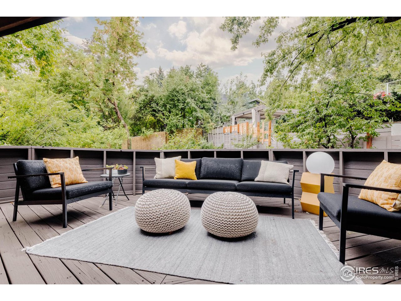 550 College Avenue Boulder, CO 80302 - Photo 31 of 36 a view of a patio with couches table and chairs and potted plants