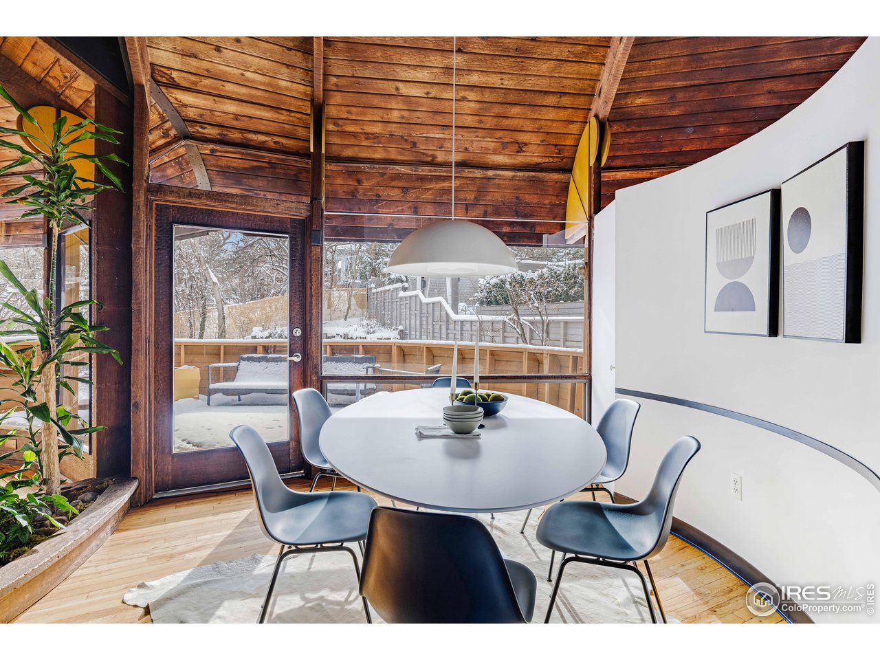 550 College Avenue Boulder, CO 80302 - Photo 6 of 36 a dining room with furniture and wooden floor