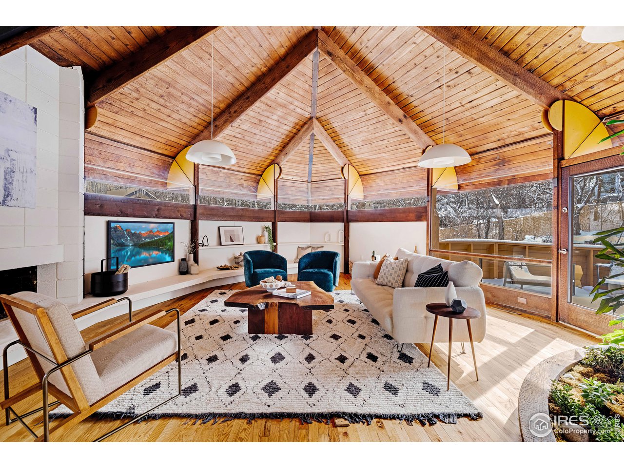 550 College Avenue Boulder, CO 80302 - Photo 7 of 36 a living room with furniture a rug and a chandelier