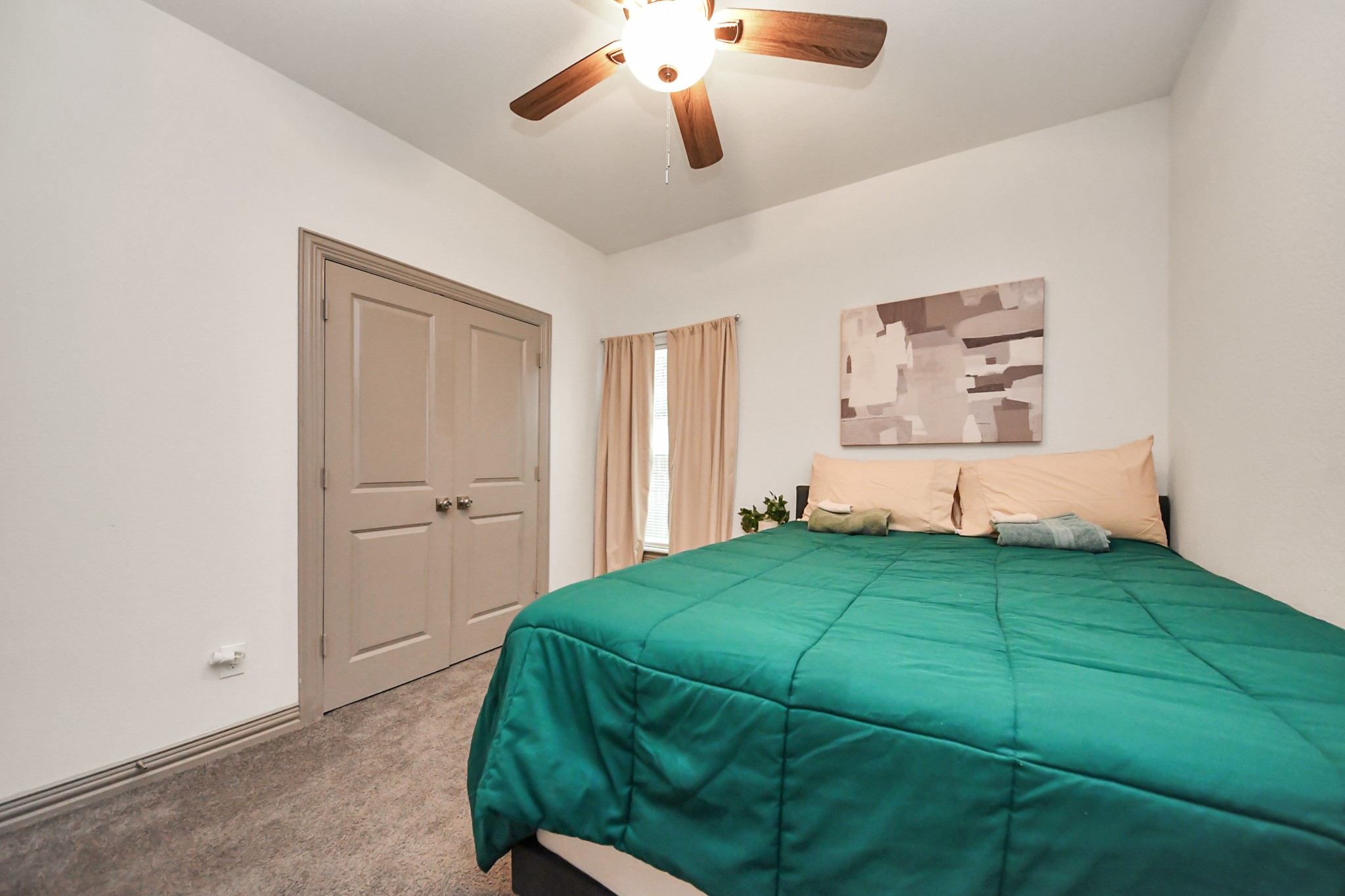 5334 Pershing Street Houston, TX 77033 - Photo 15 of 43 a bedroom with a bed and a painting on the wall