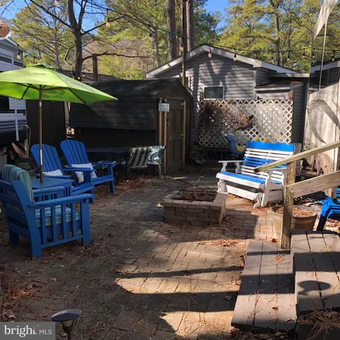 a view of a chairs and tables in the patio