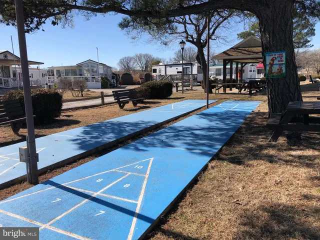 a view of a balcony with table and chairs