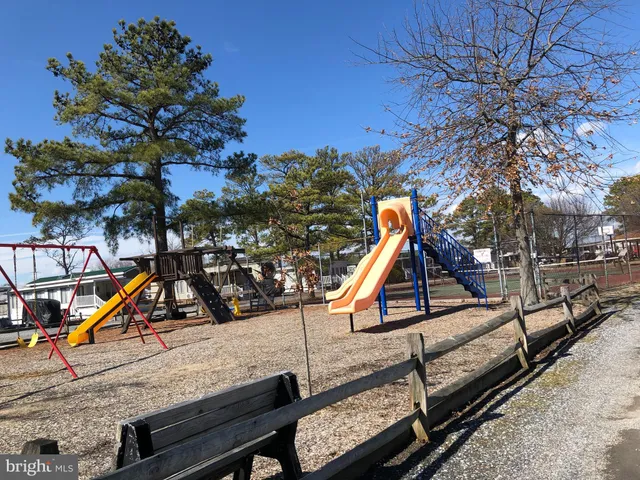 a view of a patio with table and chairs and potted plants