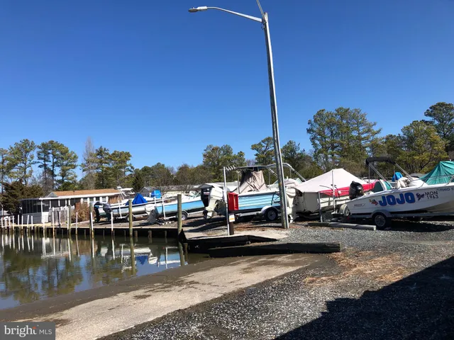 a view of swimming pool with lake view and mountain in the back