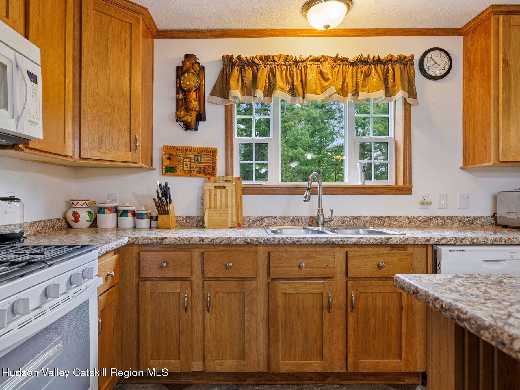 137 Mountain Pond View Road Gilboa, NY 12076 - Photo 23 of 38 a kitchen with a sink and cabinets